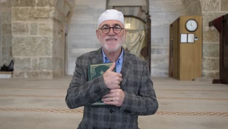 man holding quran