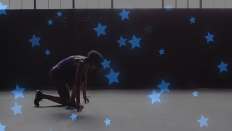 múltiples estrellas azules flotando contra una mujer afroamericana en posición de inicio lista para correr