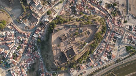 Vertical-circular-pan-aerial-shot-above-Castelo-de-Castro-Marim-Castle,-Algarve,-Portugal