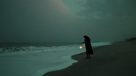 mysterious guardian of island looks out the infinity of the stormy sea at night