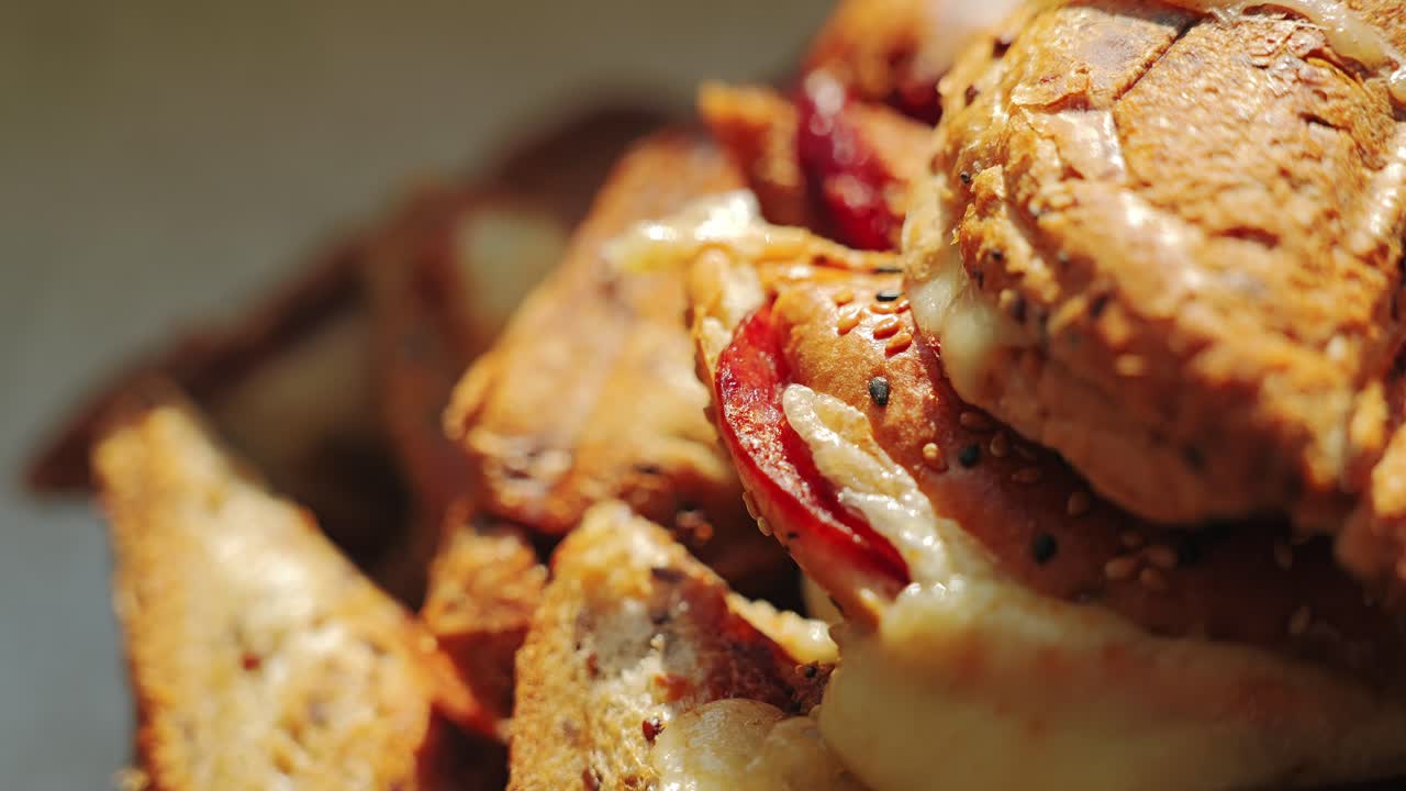 Appetizing close-up of toasted sandwich stack in cozy kitchen light with texture