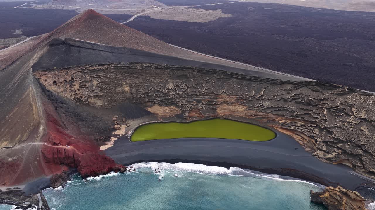 El Golfo's green lagoon by volcanic cliffs in Lanzarote, serene landscape