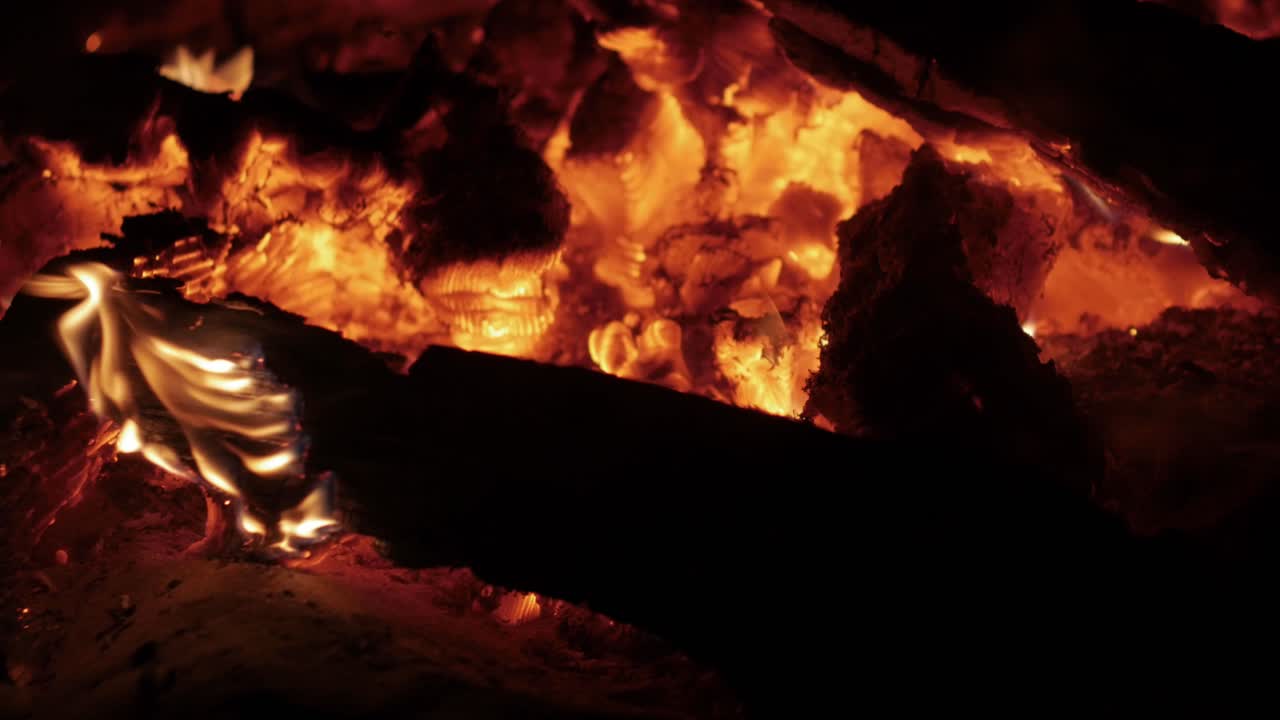 Wind blowing across the coals of a burnt out campfire