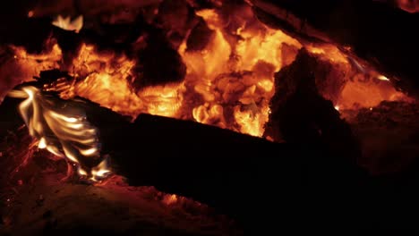 wind blowing across the coals of a burnt out campfire