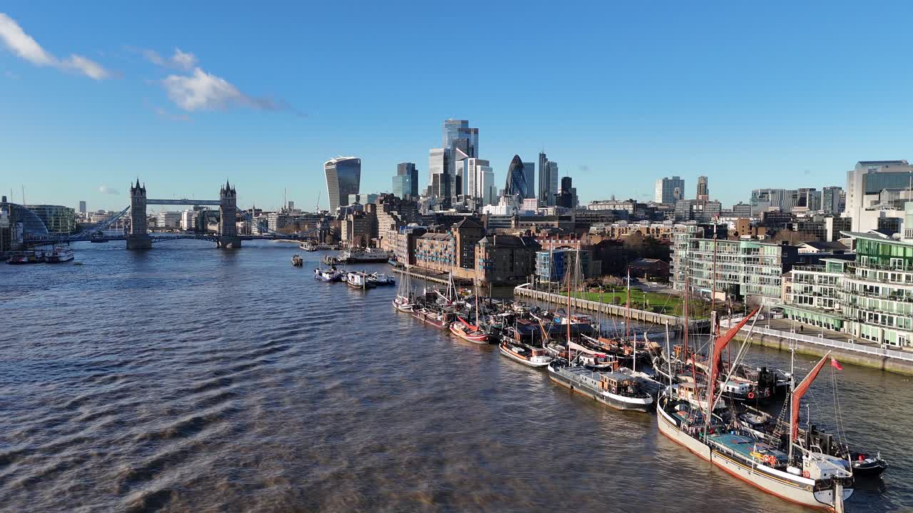 Old sailing barges moored on river Thames near Tower bridge drone,aerial