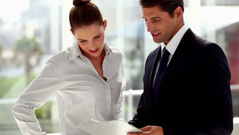 Two-business-people-working-on-documents