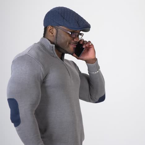 guy holding and using smartphone. young african man using mobile cell phone