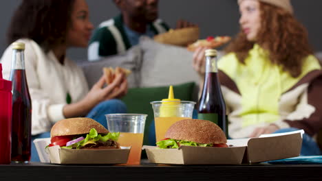 three friends eating at home