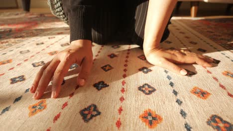 woman sitting on carpet