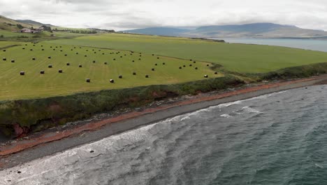 haystacks along the sea in iceland, view from drone