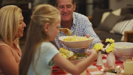 happy family eating dinner together.