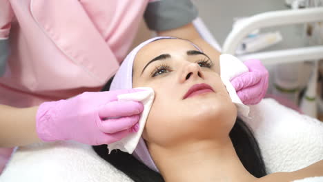 cleaning the skin, a beautiful woman in the beauty salon beauty. cosmetologist job.