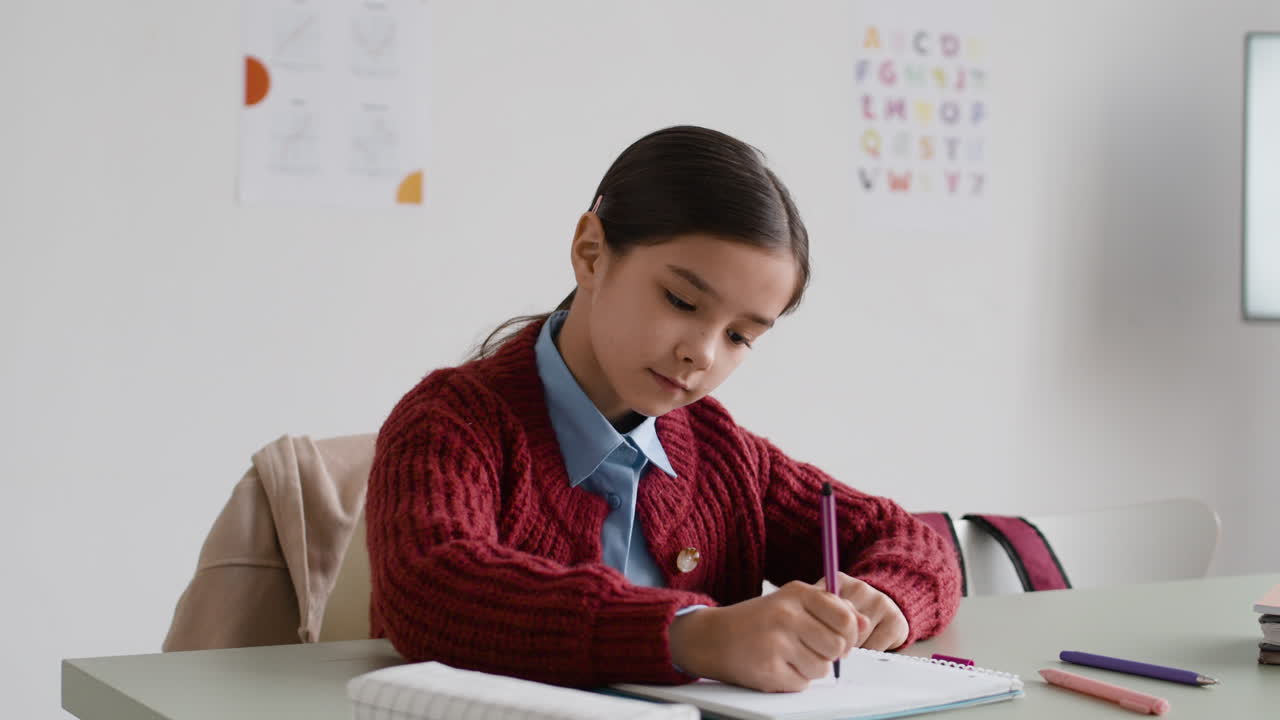 Girl Studying in Classroom