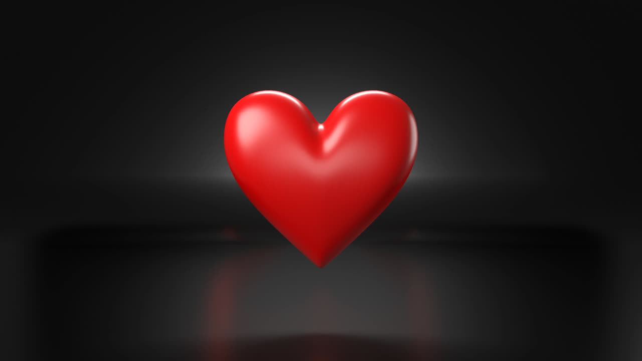 objeto pulsante en forma de corazón rojo sobre fondo negro.
