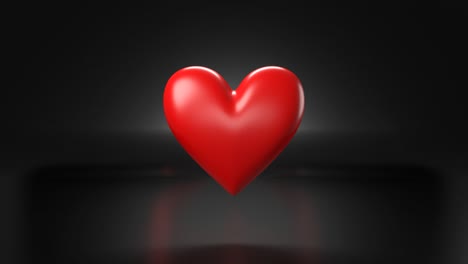 objeto pulsante en forma de corazón rojo sobre fondo negro.