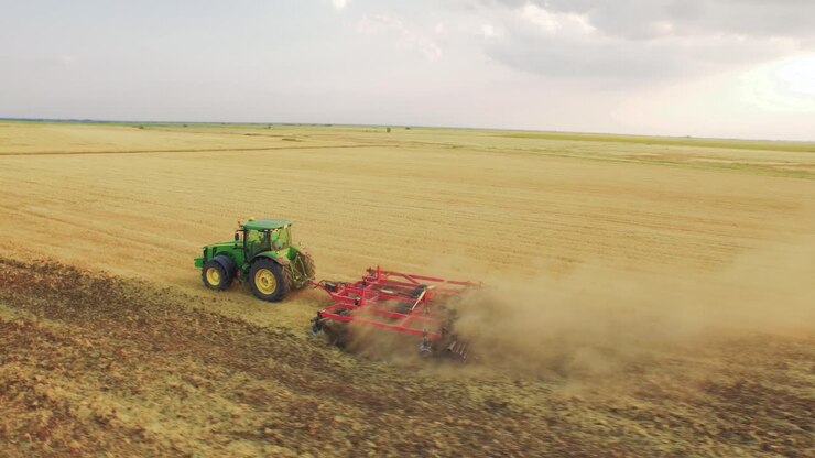 Tractor Tilling a Wheat Field