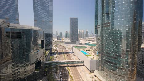 al 'oud street in abu dhabi, al reem island, united arab emirates - tilt up to reveal the city skyline at daytime