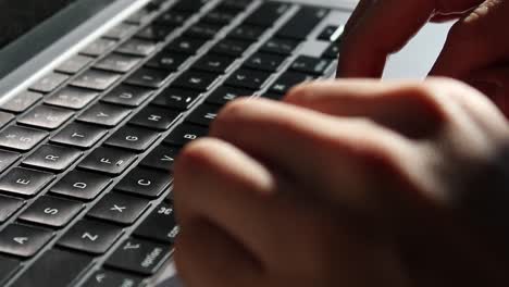 Hands-typing-on-a-laptop-keyboard