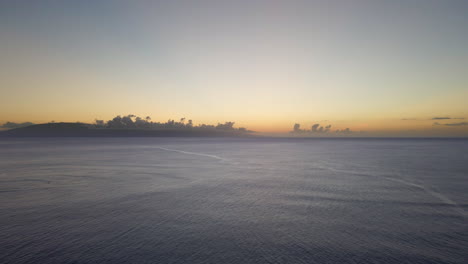 spectacular sunset over pacific ocean at hawaiian coast, aerial view