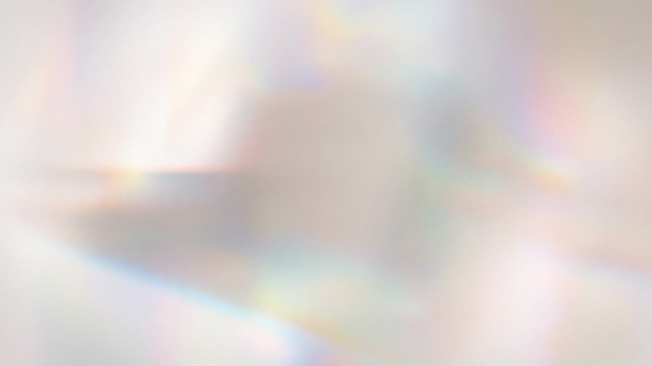 Soft abstract background with bright white light, subtle rainbow prism reflections, and smooth blurred glow across the frame