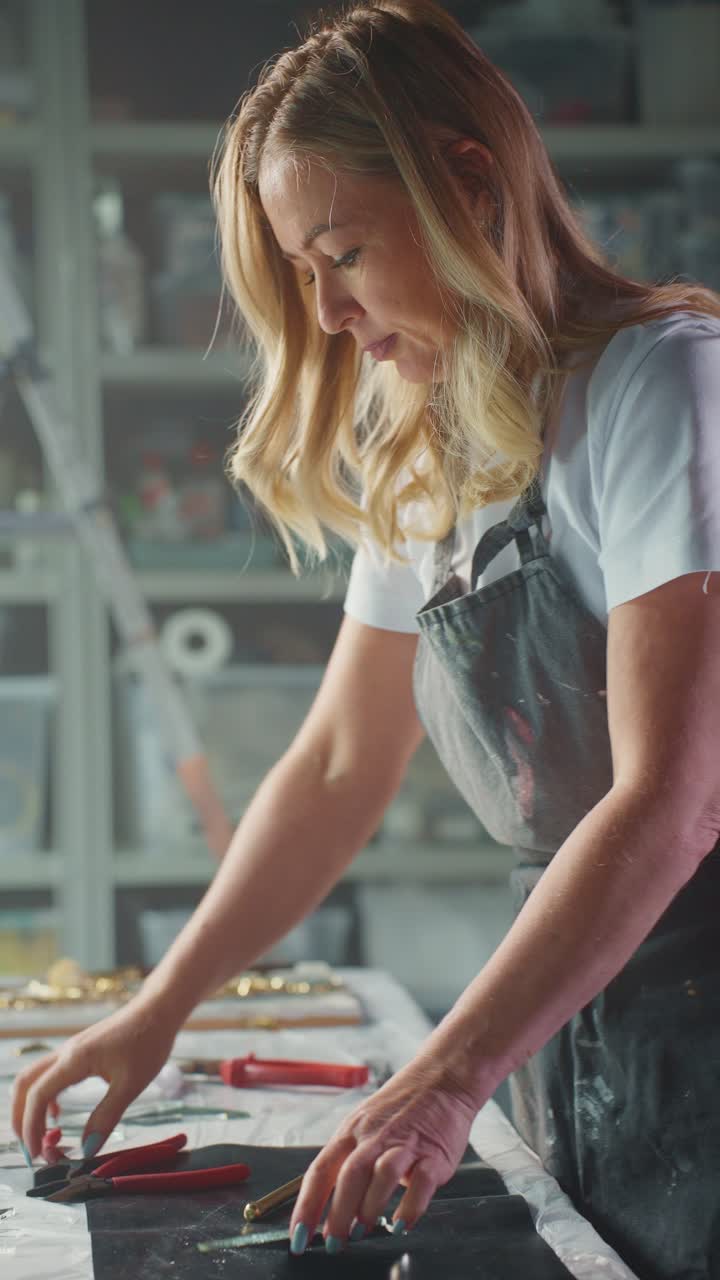 Woman working on glass art project