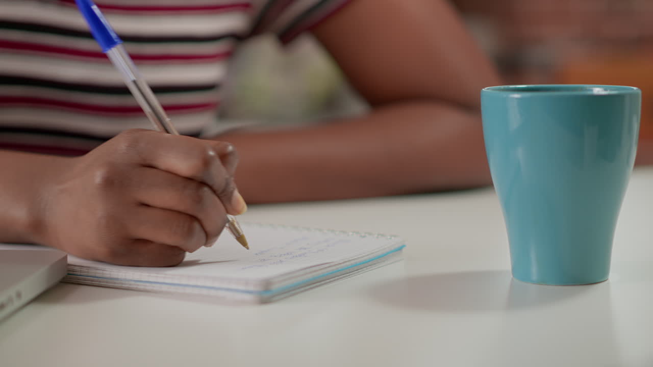 Writing in a Notebook