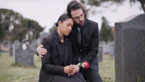 Sad-couple,-rose-and-graveyard-in-loss