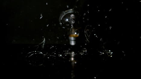 light bulb crashing on the floor in slow motion