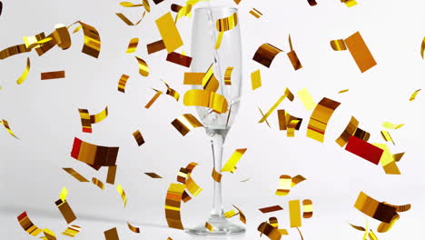 Animation-of-confetti-falling-over-champagne-glass