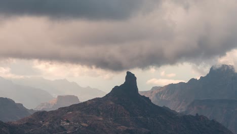 Close up Timelapse of Roque Bentayga under shifting clouds in Gran Canaria. The rugged volcanic landscape creates a mystical and cinematic scene. Ideal for nature, travel, and adventure projects.