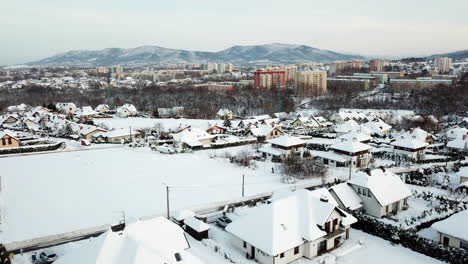 drone flight over city in poland during winter sunny day