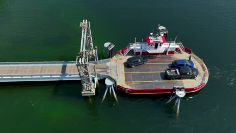 overhead aerial view of an suv boarding a small commuter ferry in washington state