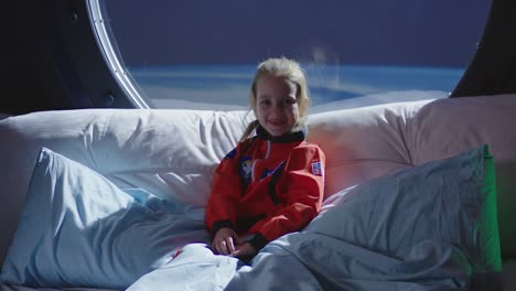 young astronaut in a space bed