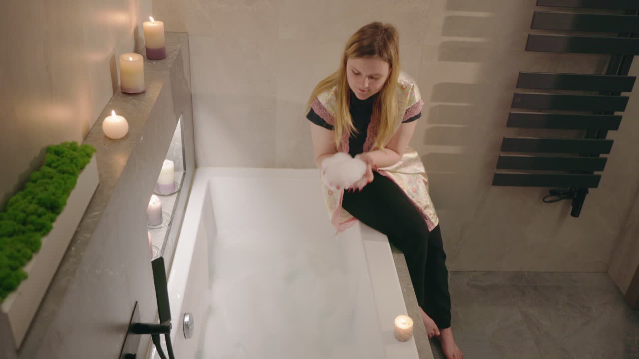 Woman enjoying a bubble bath at home