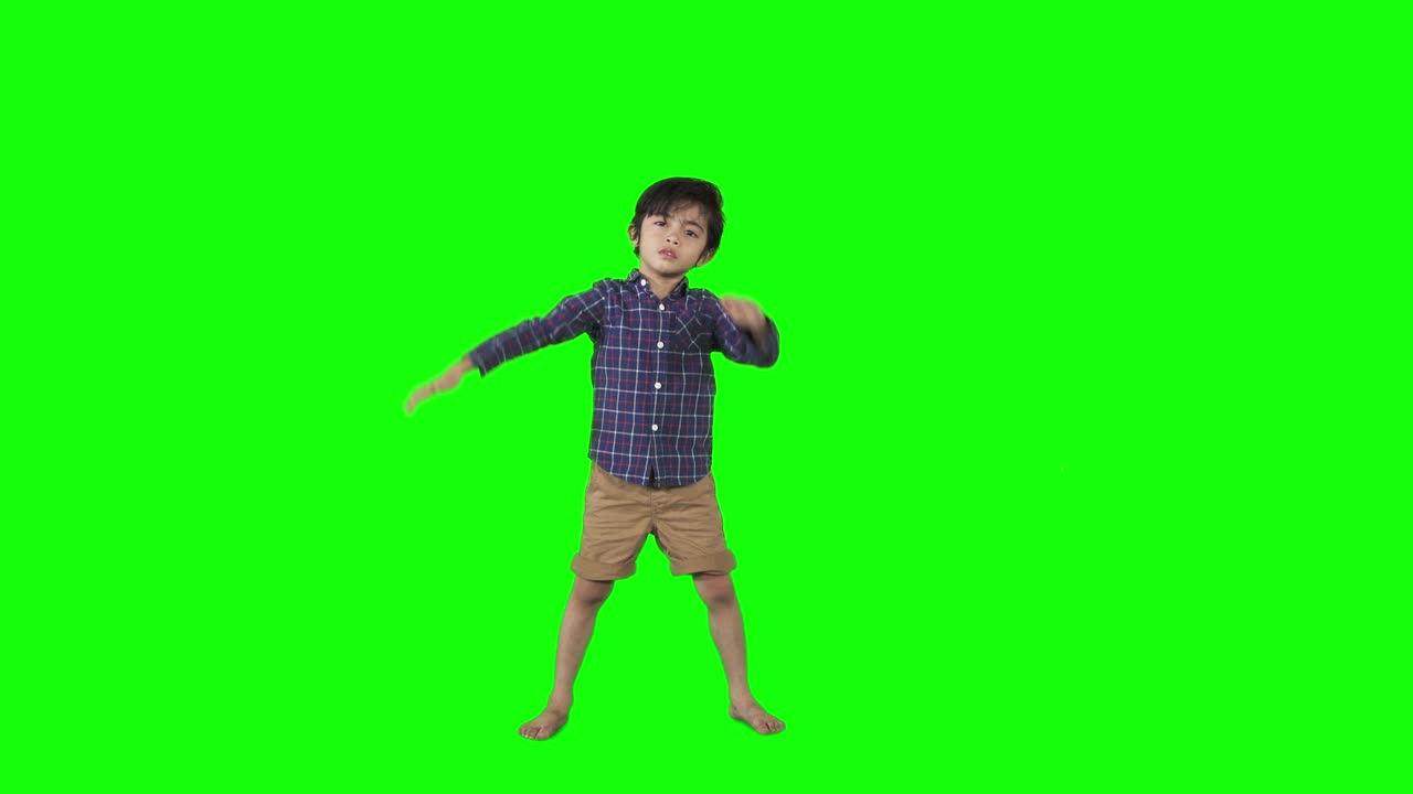 niño pequeño bailando dab o haciendo gesto dab