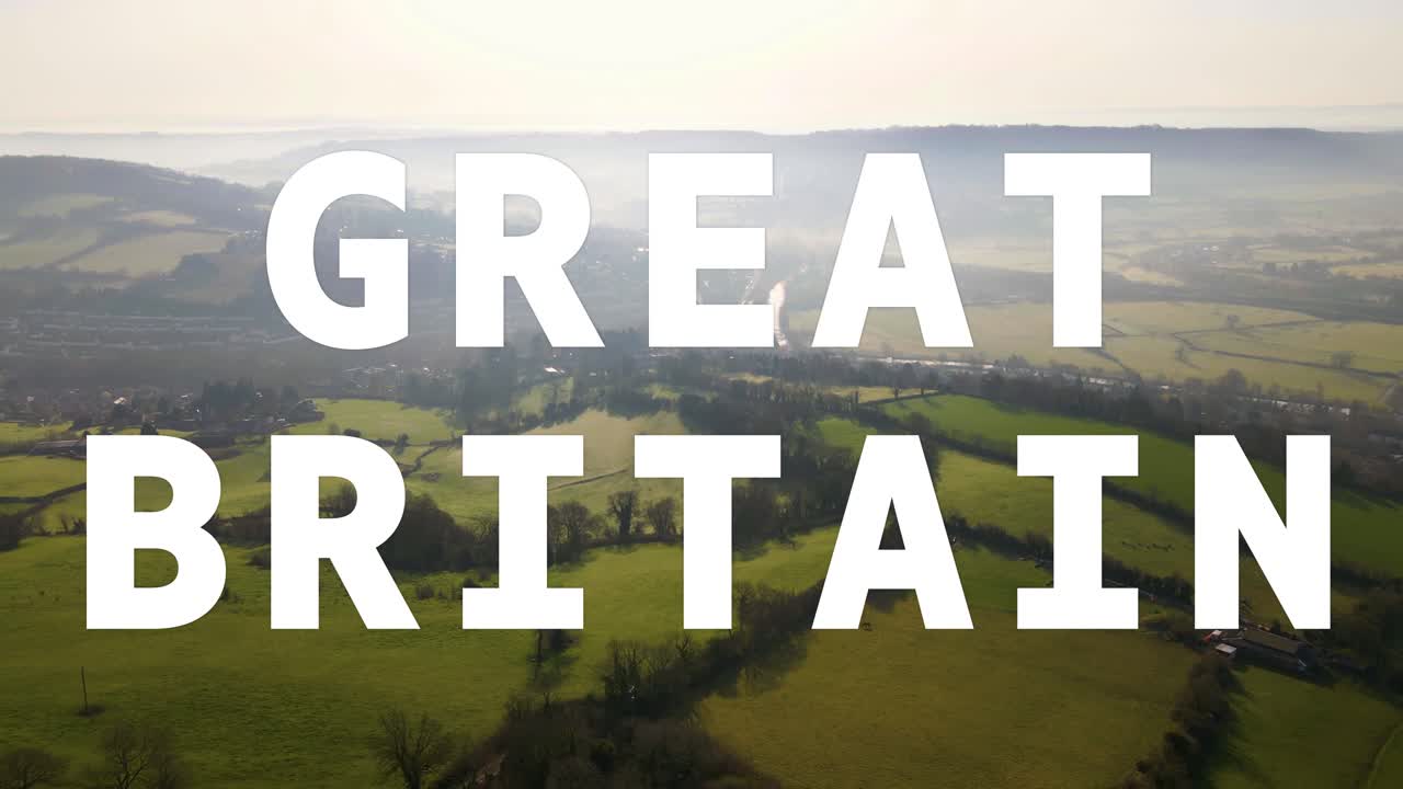 disparo aéreo de drones de campos y campos en el reino unido con gráficos animados que deletrean gran bretaña