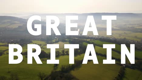 Aerial-Drone-Shot-Of-Fields-And-Countryside-In-UK-With-Animated-Graphic-Spelling-Out-Great-Britain