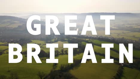 aerial drone shot of fields and countryside in uk with animated graphic spelling out great britain