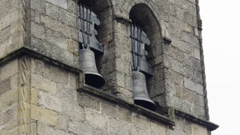 close up old bells in one of the bell towers in guimaraes castle portugal