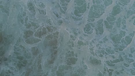 Abstract-birds-eye-foamy-ocean-waves