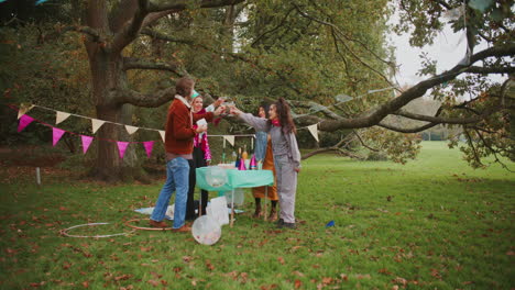 friends celebrating in a park