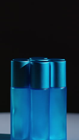 group of blue roll-on perfume bottles