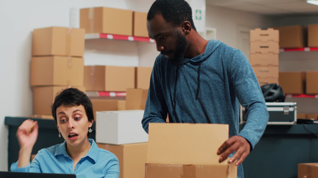 Warehouse workers packing boxes