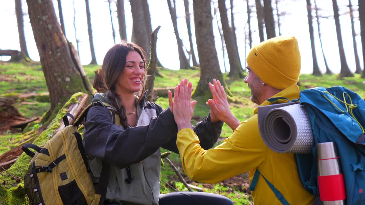 Couple Hiking in Forest with Backpacks
