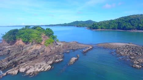 Small-rocky-islands-poking-out-of-the-crystal-clear-blue-pacific-ocean-just-off-the-coast-of-Panama-in-Central-America