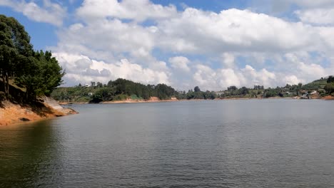 sailing in guatape lake on sunny summer day, colombia