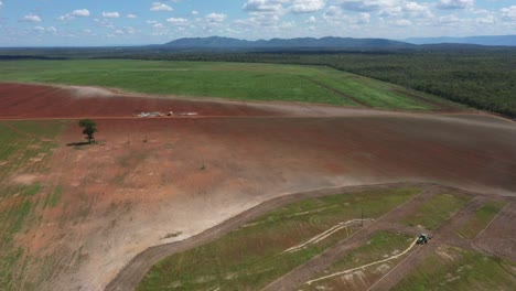 land cleared by deforestation of the brazilian savannah to plow and plant soybeans - aerial pull back reveal