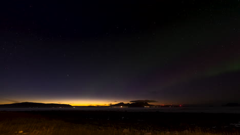 aurora borealis light display in the arctic, streaking green lights, time lapse