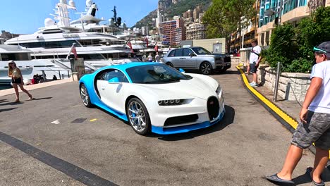 a car and yachts at monte carlo pier