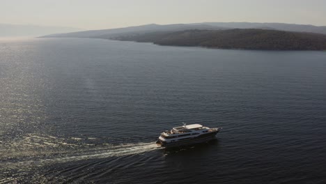 Yacht-sailing,-island-in-background